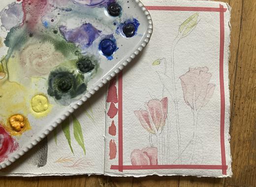 watercolor pallet and sketchbook