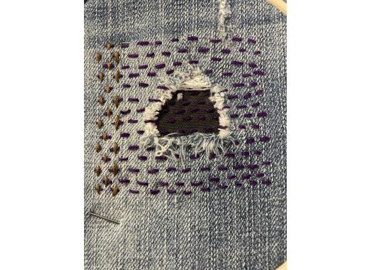image of a mended hole in a pair of jeans